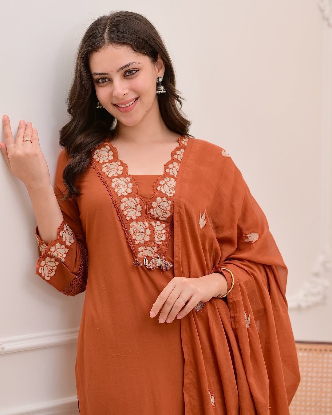 Delightful Rust Orange Mul Cotton Embroidery Suit Set